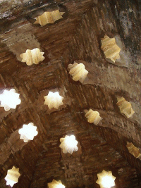 Ceiling inside the Turkish Baths, Alhambra, Granada, Spain