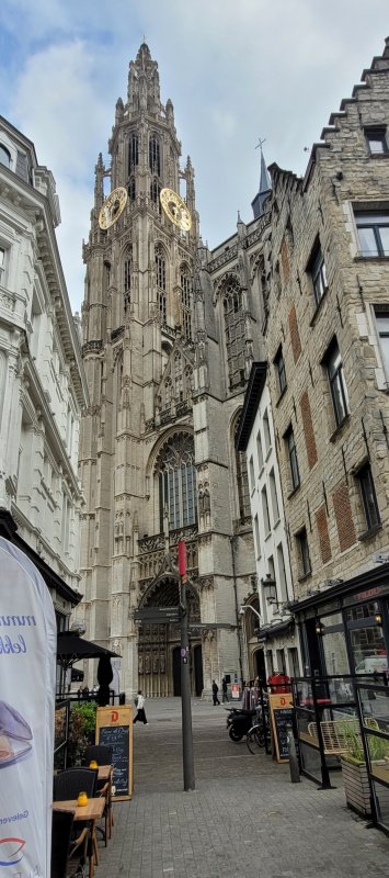 Onze Lieve Vrouwekathedraal peeking through the old buildings of Antwerp, Belgium