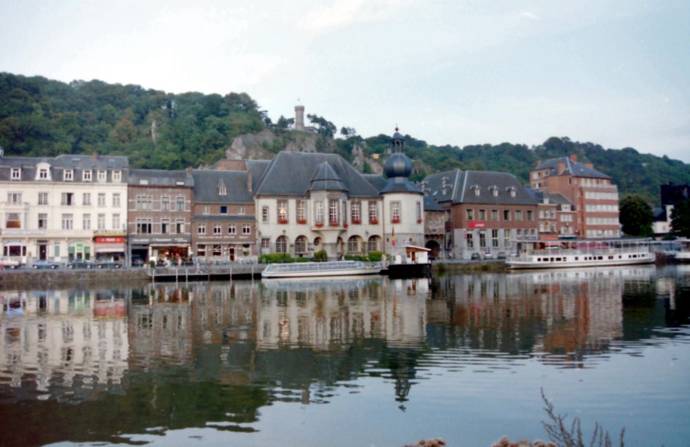 Calm Waters of the Meuse with Mont Fat Tower in the backgroubd, Dinant, Belgium