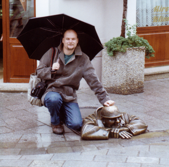 Andrew with the Man at Work street sculpture in Bratislava, Slovakia