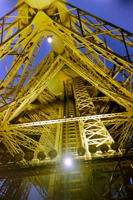 Walking Down the Eiffel Tower at Night, Paris, France